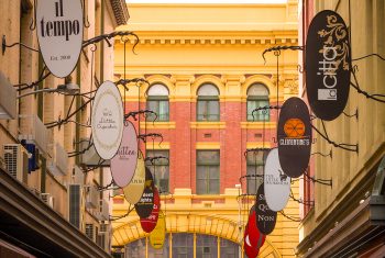 Flinders Street Station rises out of the boutique sttore signs, Melbourne Victoria